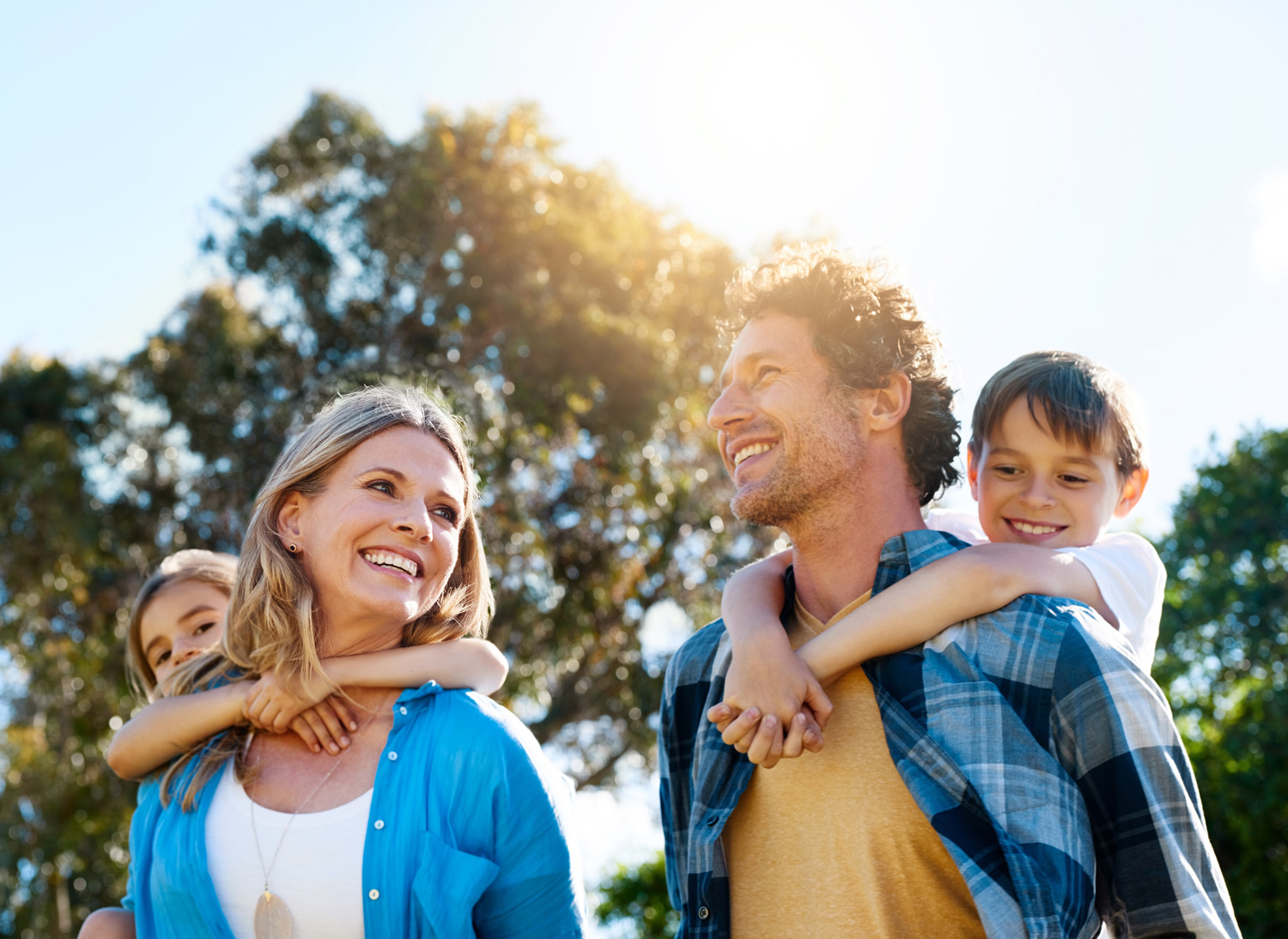 Family of four enjoys a sunny day outside.
